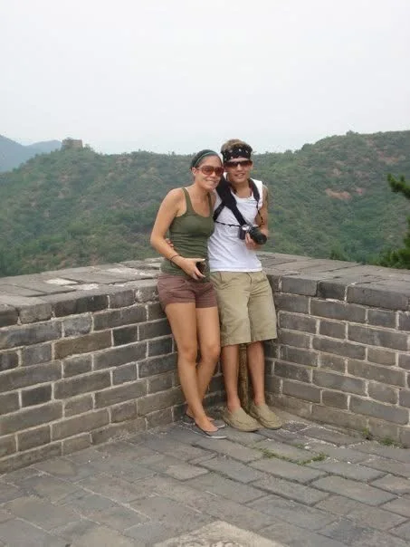 Rachelle and Adam Poffenberger standing together on the Great Wall of China